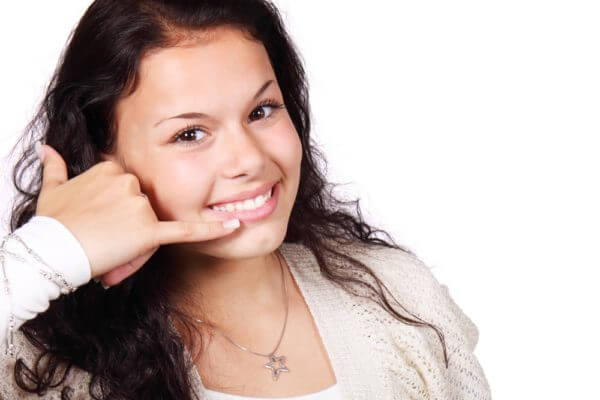 Woman Making Telephone Hand Gesture