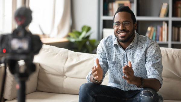 Man-speaking-into-camera-for-virtual-event