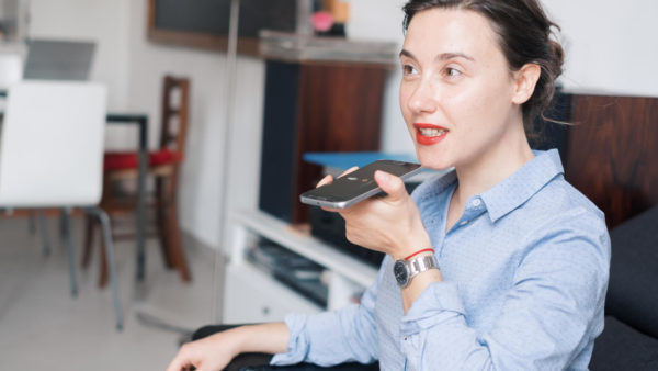 Woman-talking-into-phone-on-Clubhouse