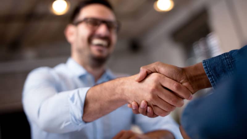 Business people shaking hands.