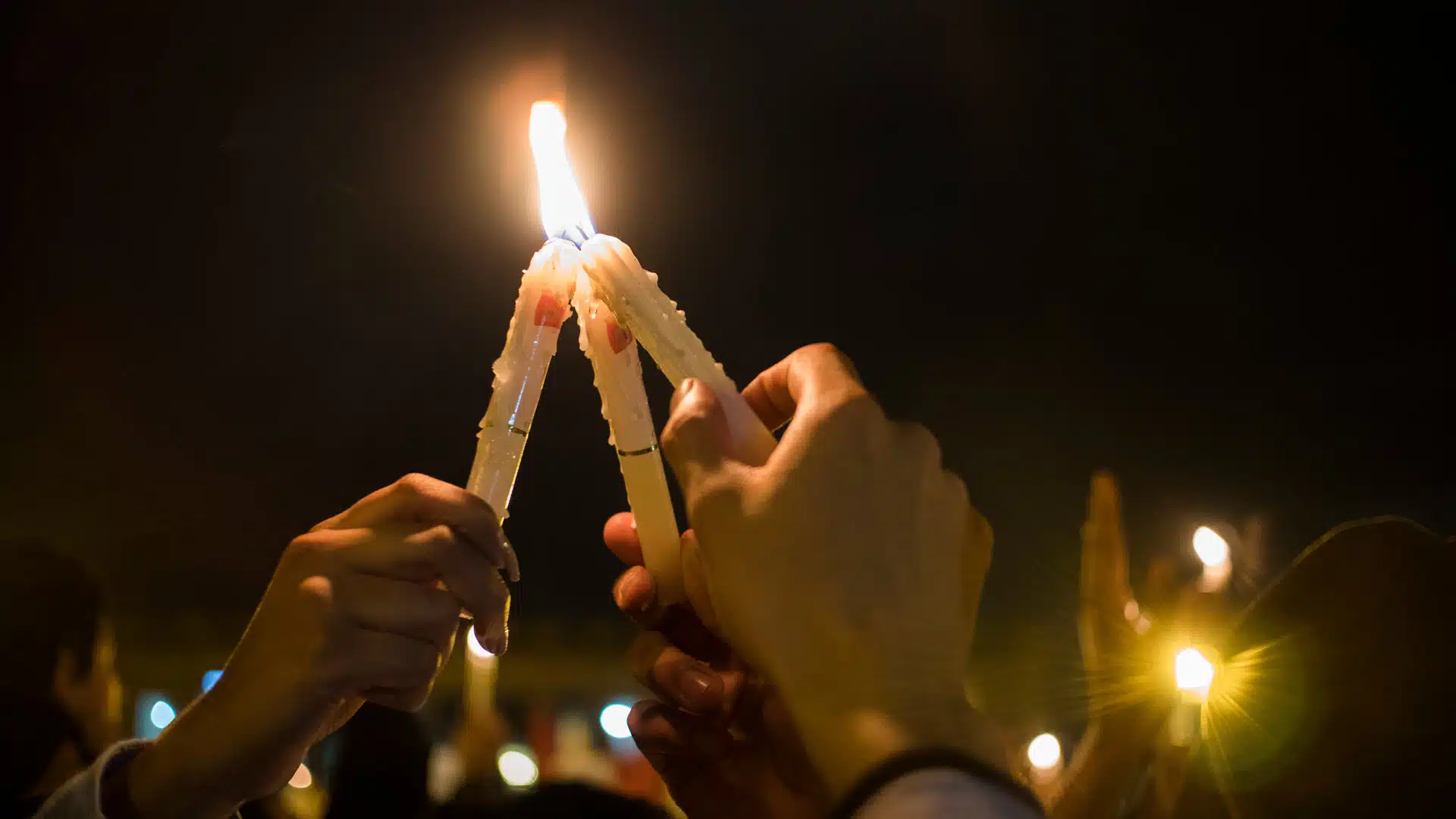 people-holding-candles